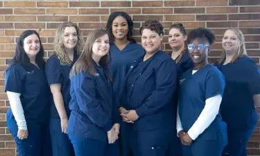 Orlando ABSN Student Smiling at Patient