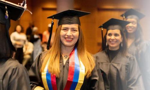 Herzing Missouri Online BSN Student Smiling at Graduation Ceremony 